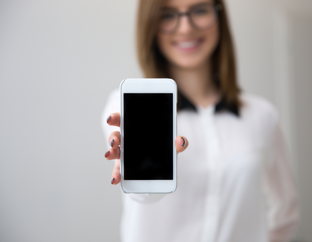 Businesswoman Showing A Blank Smartphone Screen Focus On Smartphone